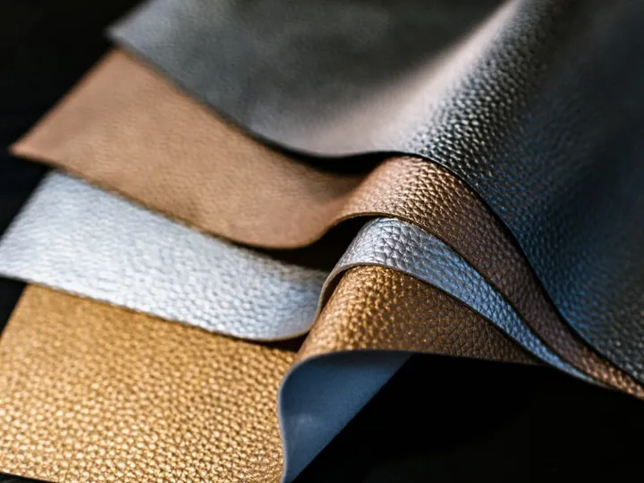 Layered leather swatches in brown, tan and blue gray grains